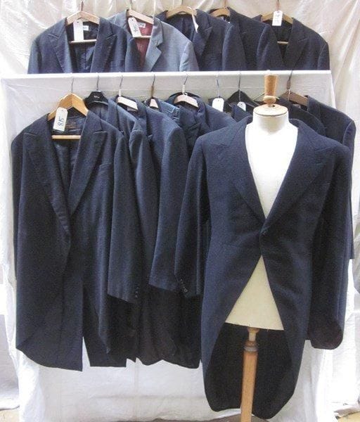 Une quinzaine de vestes d'habit en lainage pour homme, style début XXe.