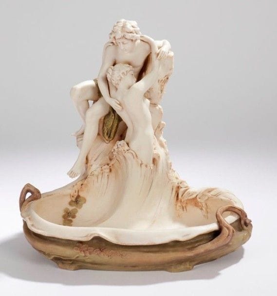 Aloïs HAMPEL (1967-1922) & ROYAL DUX Bohémia
Amoures naissantes - Groupe en porcelaine polychrome, rehauts de dorure éparses. Signé HAMPEL sur l'arrière et porte le cachet ROYAL DUX Bohémia sous la base. 32 x 30 x 24 cm