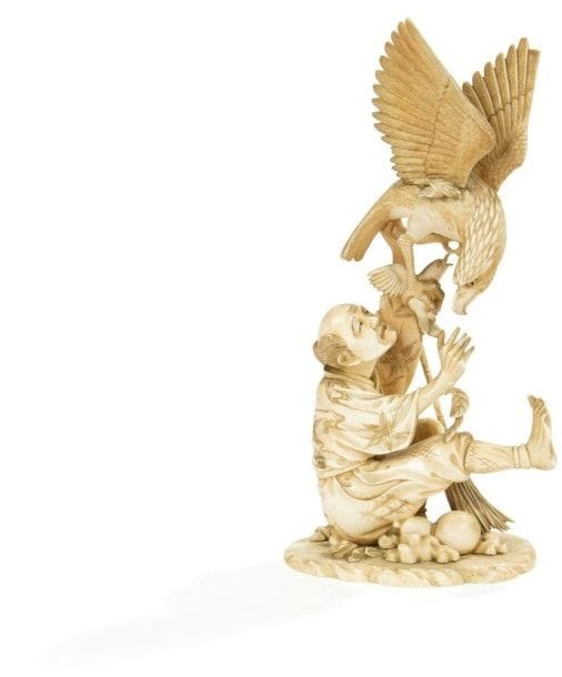 JAPON - Epoque MEIJI (1868 - 1912)

Okimono en ivoire à patine jaune, paysan attaché par un rapace lui volant un oiseau. 
(Accidents). 
Hauteur: 23,5 cm