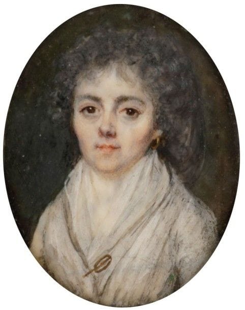 École FRANÇAISE vers 1790
Femme en robe blanche, sa guimpe de linon fermée par une épingle d'or
Miniature sur ivoire de la fin du XVIIIe siècle, ovale 3,8 x 3,4 cm
Cerclage en laiton doré avec anneau de suspension, ovale, 5 x 4,2 cm