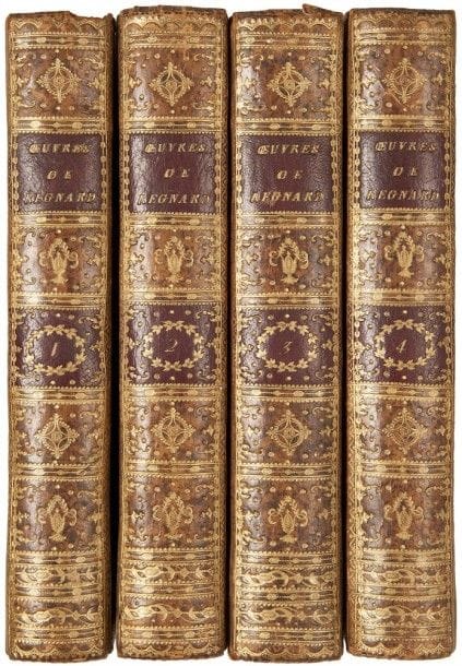 REGNARD (Jean-François).
Oeuvres.
Paris : Maradan, 1790. — 4 volumes in-8, 216 x 134. Veau raciné, roulette dorée en encadrement sur les plats, dos lisse richement orné, roulette dorée intérieure, tranches dorées (reliure de l’époque).

Édition illustrée d’un portrait non signé et de 12 figures hors texte dont 9 d’après Borel.
Le premier volume est consacré aux voyages de Regnard en Laponie, Pologne, Hollande, Allemagne…, on y trouve également un catalogue de ses pièces. Les 3 autres volumes contiennent son théâtre.
Bel exemplaire sur beau papier, dans une reliure au dos richement doré. Manque partiel aux coiffes supérieures des tomes I et III, charnières fendillées et quelques égratignures. Quelques rousseurs éparses, mouillures et brunissures.
Provenances : J.M.M. Van Belle, avec son ex-libris armorié « Pharmacopola Amstelaedamensis 1883 ». - Félix Bienaimé Feuardent (1819-1907), libraire et numismate de Cherbourg, avec son ex-libris.