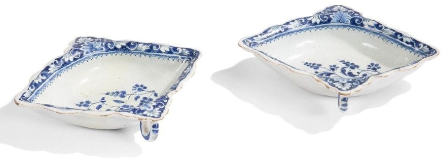 ROUEN

Trois saucières ovales à deux anses latérales en faïence, deux à décor en camaïeu bleu de tiges fleuries au centre et de galon orné de rinceaux feuillagés sur fond bleu sur les bords, la troisième à décor en camaïeu bleu au centre d'une corbeille fleurie et sur le bord d'un galon à motifs d'écailles et rinceaux feuillagés.
XVIIIe siècle.
L.: 18 cm et 19 cm
Une anse recollée, petite fêlure et un éclat