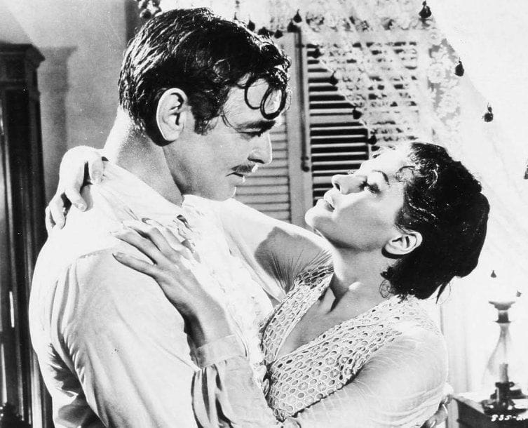 Band of angels (L'esclave libre), 1957. De Raoul Walsh, avec Clark Gable, Sidney Poitier et Yvonne De Carlo. Six tirages argentiques d'époque. Tampon de presse et étiquette tapuscrite aux versos. 24 x 19 cm.