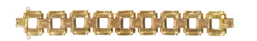 Bracelet en deux tons d’or 18K (750‰), maillons carrés scandés de barrettes. 
Travail français. 
Long. : 19,5 cm environ. 
Poids : 62,9 g
