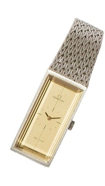 OMEGA. Montre bracelet de dame en or gris 18K (750‰). Années 70. Mécanisme mécanique. Verre bizoté, cadran champagne avec petit cadran au centre.
Poids brut : 53 g
Fonctionne, bon état.