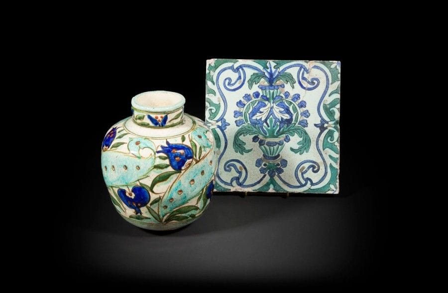 LACHENAL Raoul(1885 -1956) Vase et carreau dans le style Iznik, XIXe siècle.
Vase à décor de palmes bordées de tulipes et de grenades, signé à la base Raoul Lachenal et sa marque ; - Carreau de revêtement orné d’une composition tête-bêche et de feuilles d’acanthes sortant d’un vase dans un cartouche alvéolé en réserve sur fond vert.  
Hauteur: 23cm; Dim. : 25 cm  x 25 cm
État : fêlures et sauts d’émail  
LACHENAL Raoul (1885 -1956) an Iznik style pottery vase and a tile, 19th century