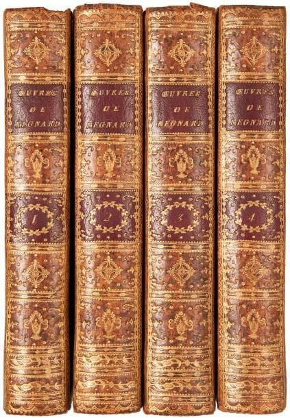 REGNARD (Jean-François).
Œuvres.
Paris : Maradan, 1790. — 4 volumes in-8, 216 x 134. Veau raciné, roulette dorée en encadrement sur les plats, dos lisse richement orné, roulette dorée intérieure, tranches dorées (reliure de l’époque).

Édition illustrée d’un portrait non signé et de 12 figures hors texte dont 9 d’après Borel.
Le premier volume est consacré aux voyages de Regnard en Laponie, Pologne, Hollande, Allemagne…, on y trouve également un catalogue de ses pièces. Les 3 autres volumes contiennent son théâtre.
Bel exemplaire sur beau papier, dans une reliure au dos richement orné. Manque partiel aux coiffes supérieures des tomes I et III, charnières fendillées et quelques égratignures. Quelques rousseurs éparses, mouillures et brunissures.
Provenances : J.M.M. Van Belle, avec son ex-libris armorié “Pharmacopola Amstelaedamensis 1883”. - Félix Bienaimé Feuardent (1819-1907), libraire et numismate de Cherbourg, avec son ex-libris.
