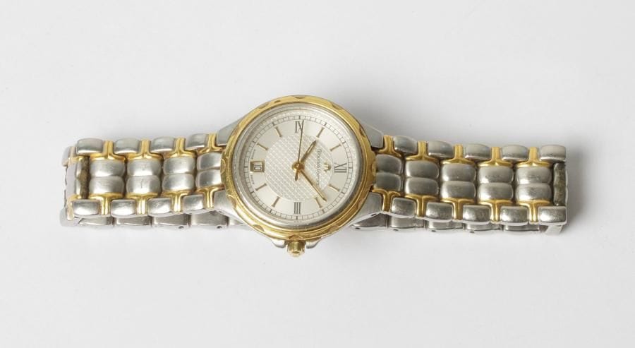 MAURICE LACROIX. Montre bracelet de dame en acier et métal doré. Date à 6H