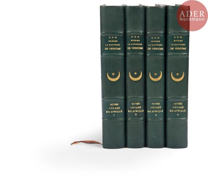 S.A.R. MADAME LA DUCHESSE DE VENDOME
Notre voyage en Afrique (Algérie, Tunisie, Maroc), avec une introduction de L. Bertrand, 4 volumes, Paris 1928. 
Reproduction intégrale du manuscrit de Madame la Duchesse, avec plusieurs dessins en couleurs dans et hors-texte. Premier vol. porte une dédicace « Au Commandant Hériot, amateur intelligent du ‘voyage’ une des joies d’ici-bas! » signée « Henriette, Duchesse de Vendôme, Princesse de Belgique », daté « Avril 1936 ». Ex-libris Dominique et Yvan Comolli. Reliure moderne en demi-chagrin à coins. 