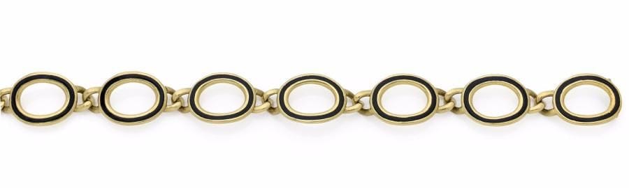 Bracelet en or 18K (750 ‰) articulé de 7 maillons ovales cernés d’émail bleu nuit. 
Longueur : 20,2 cm environ.
Poids brut : 48,6 g