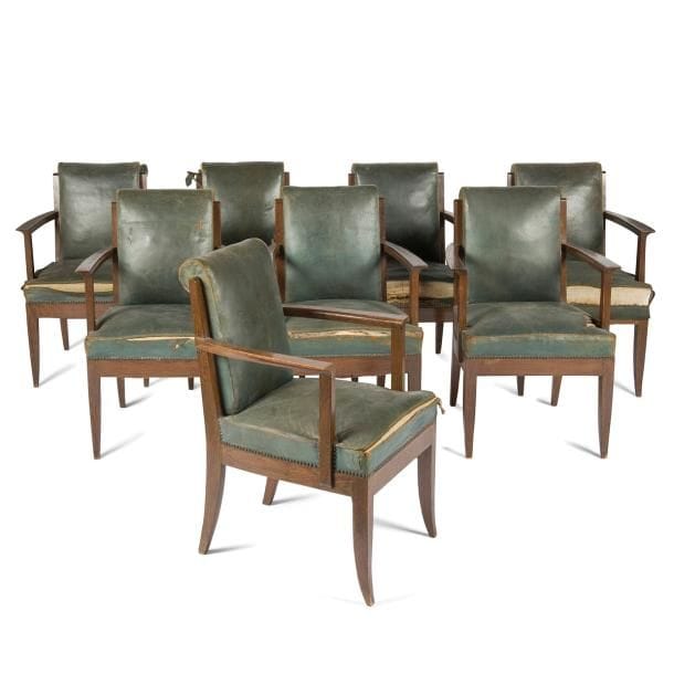 Léon JALLOT (1867-1974) & Maurice JALLOT (1900-1971)

Rare suite de huit fauteuils de table en chêne teinté et très légèrement blanchi au zinc.
L’assise, à large ceinture, repose sur quatre pieds sabre se poursuivant, à l’arrière, en montants de dossier.
Accotoirs à manchette débordante et sculptée.
Garnitures et tapisseries en cuir vert d’origine (usagées).
Circa 1932 / 35
82 x 55,5 x 56 cm 

Bibliographie :
Nouveaux intérieurs français, 3ème série - Éditions Charles Moreau, Paris. Modèle identique reproduit planche 12.  