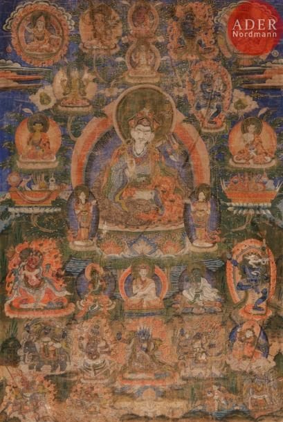 TIBET - XIXe siècle
Tangka, détrempe sur toile. Padmasambhava au centre sur fond bleu, assis sur le lotus, tenant un vajra dans la main droite, le kapala contenant le vase d’immortalité dans la main gauche, le Khatvanga trishula reposant entre son bras et son épaule gauche ; entouré de divinités en furie, lamas et bouddha. (Usures).
Dim. : 74 x 50 cm.