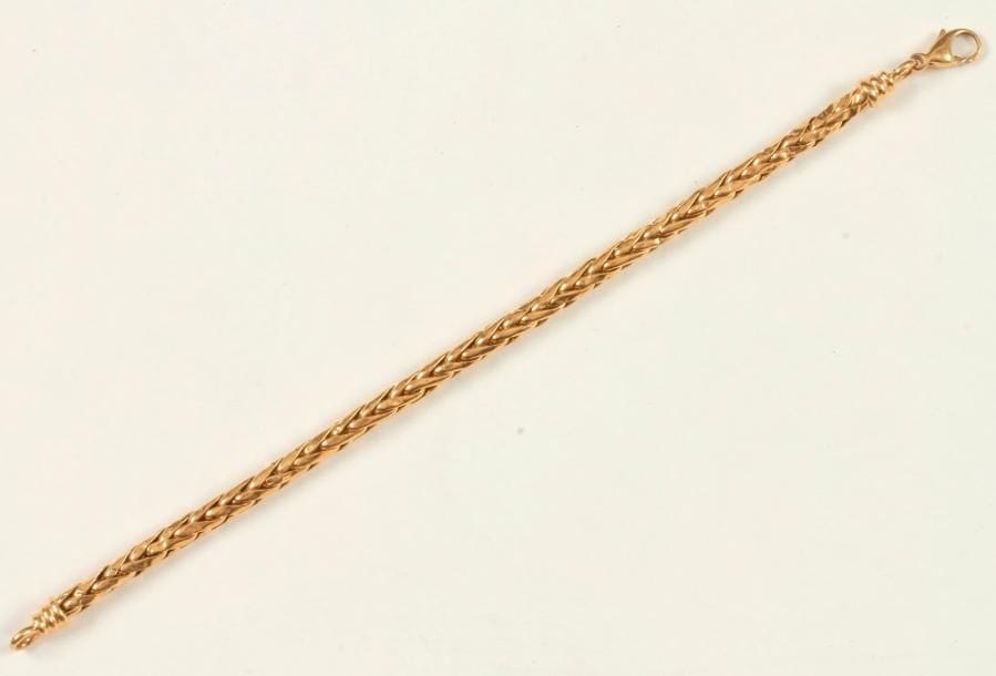 Bracelet en or 18K (750 ‰), maillons palmier. Longueur : 18 cm environ. 
Poids : 9 g (enfoncements)