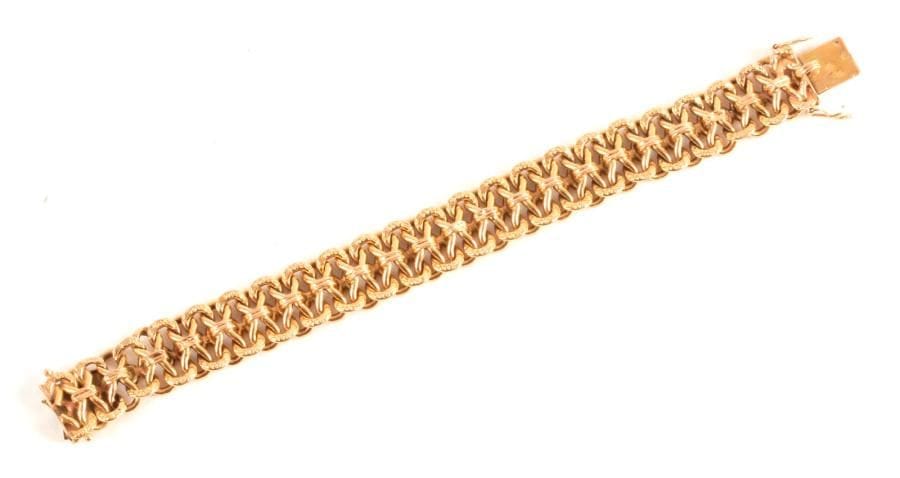 Bracelet en or 18K (750 ‰), articulé de maillons en 8. Longueur : 18 cm environ.
Poids : 25,5 g