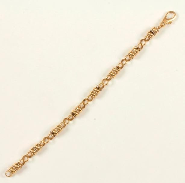 Bracelet en or 18K (750 ‰), articulé d'anneaux et de maillons bombés alternés. Longueur : 21 cm environ. Poids : 29,5 g