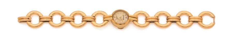 JAEGER-LE-COULTRE pour HERMÈS. Montre de dame en or 18K (750 ‰), cadran rond, index batons, bracelet articulé d’annneaux en or 18K (750 ‰), mouvement mécanique. Numérotée. Longueur : 16,8 cm environ. 
Poids brut : 33,3 g