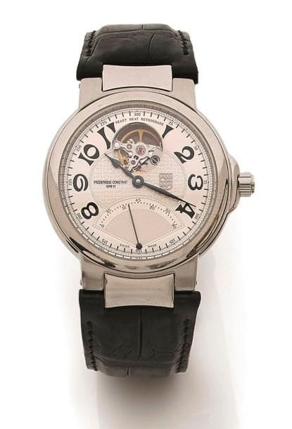 Frédérique CONSTANT Genève.
Montre bracelet d’homme en acier, automatique, échappement visible à 12H. Trotteuse rétrograde, chiffres arabes, cadran argenté. Fond de boîte en verre permettant de voir le mécanisme. Modèle étanche, couronne vissée et siglée.
Écrin.