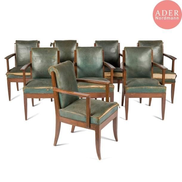 Léon JALLOT (1867-1974) & Maurice JALLOT (1900-1971)
Rare suite de huit fauteuils de table en chêne teinté et très légèrement blanchi au zinc. L'assise, à large ceinture, repose sur quatre pieds sabre se poursuivant, à l'arrière, en montants de dossier. Accotoirs à manchette débordante et sculptée. Garnitures et tapisseries en cuir vert d'origine (usagées). Circa 1932 / 35. 82 x 55,5 x 56 cm 

Bibliographie :
Nouveaux intérieurs français, 3ème série - Éditions Charles Moreau, Paris. Modèle identique reproduit planche 12.
