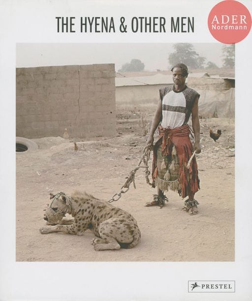 HUGO, PIETER (1976)
The hyena & other men. 
Prestel Verlag, 2007. 
In-4 (29 x 25 cm). Édition originale, signée par Pieter Hugo en 2009. Cartonnage d’éditeur sous jaquette illustrée.