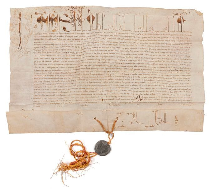 Alessandro FARNESE, PAUL III (1468-1549) Pape en 1534, grand mécène, protecteur de Michel-Ange, il convoqua le concile de Trente. Bulle manuscrite en son nom, Rome à Saint-Pierre 5 des nones d’octobre (3 octobre) 1538, 4e année de son pontificat ; vélin in-plano (30,5 x 46 cm), « Paulus » avec lettrine et initiales de la première ligne en lettres ornées (encre légèrement oxydée), sceau de plomb Paulus Papa III pendant sur cordelette rouge et jaune ; en latin.
   Le Pape concède à Johannes de Valesco, archidiacre de l’église de Virbiesca, dans le diocèse de Burgos, les bénéfices de cette charge, dont il fait brièvement l’historique avec ses privilèges. Une dizaine de signatures de chancellerie au bas du document. Au dos, cachet des archives des Señores de Moctezuma.
