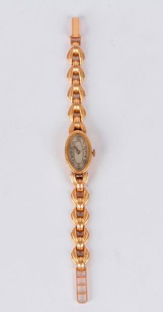 Montre de dame en or 18K (750), cadran ovale, bracelet articulé en or 18K, mouvement mécanique. Poids brut: 21,6 g (remontoir métal)