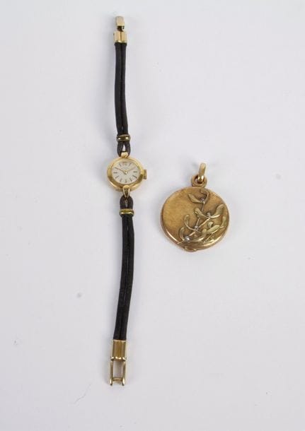 Girard Perregaux. Montre de dame en or 18K (750). Poids brut: 8,9 g (on joint un médaillon en métal)