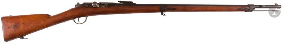 Fusil d’infanterie Modèle 1874 M 80, calibre 11 mm.
Canon rond à pans au tonnerre, avec hausse, daté 1876. Boitier de culasse marqué « Manufacture d’armes de Tulle ». Garnitures en fer et fer patiné noir, crosse en noyer avec cachet et cheville. Baguette en fer. 
A.B.E. 

