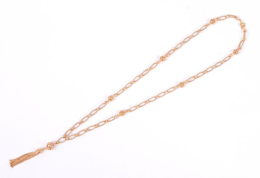 Collier en or 18K (750) articulé de maillons finement tressés alternés de boules filigranées. Longueur : 46,5 cm environ. Poids : 17,9 g