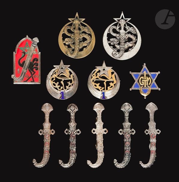 11 insignes - 2x 1er GMM ([SA] et Dr Rom), 1er Goum (Dr Ber), 5x GMM dont un en argent et 1 [AC], 2x 1er Tabor en EO Dom et surmoulage, 1er GTM Dr Ber. 