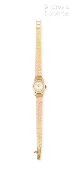 TISSOT
Bracelet-montre de dame en or jaune...