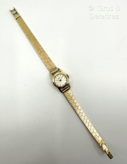 TISSOT
Bracelet-montre de dame en or jaune...