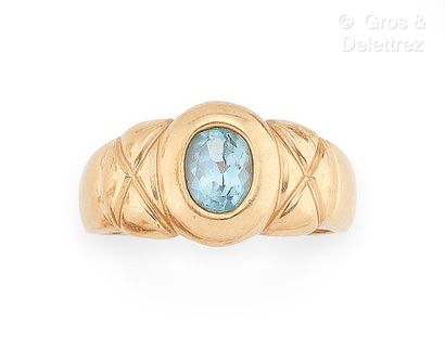 Bague jonc en or jaune 375 millièmes et topaze...