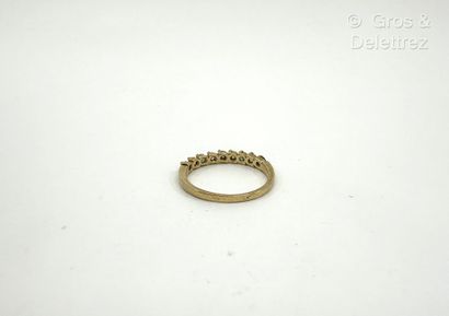 Bague rivière en or jaune 750 millièmes,...