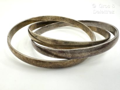 Bracelet triple jonc en métal de trois couleurs....
