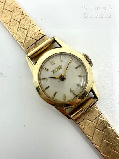 TISSOT
Bracelet-montre de dame en or jaune...