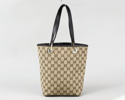 GUCCI
Sac 17cm en toile siglée beige, marron...