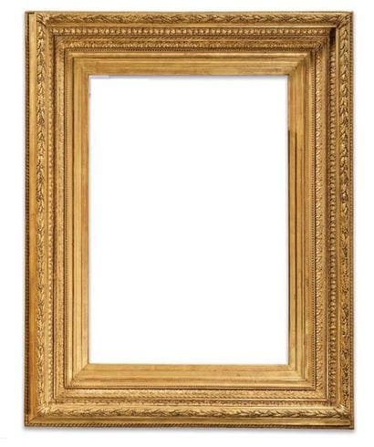 CADRE en bois et stuc dorés à décor de rais-de-coeur,...