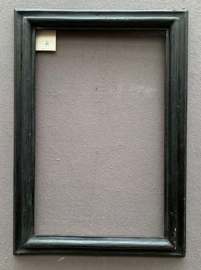 CADRE à profil renversé, en bois mouluré...
