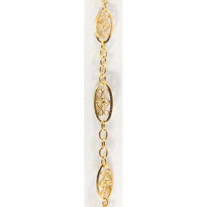 BRACELET en or jaune filigrané 750°/°°. L.18,5....