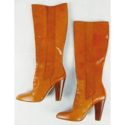 DOLCE & GABANA. Paire de bottes en cuir orange....