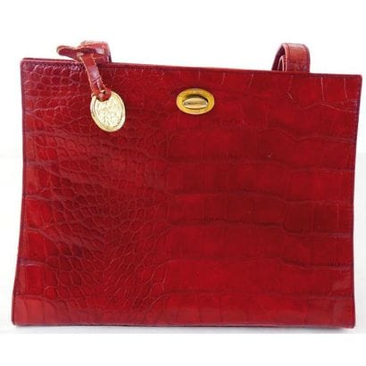 Sonia RYKIEL. Sac rigide en cuir rouge façon...