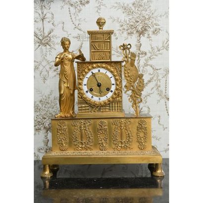 RESTAURATION PENDULE in gilded bronze representing...