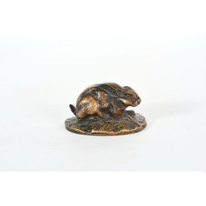 BARYE A.L. « Lièvre couché ». Petit bronze....