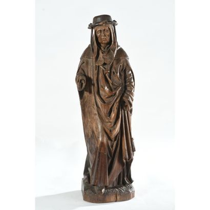 SUBJECT in patinated oak representing Saint...