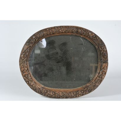A LOUIS XIV frame forming a mirror in carved...