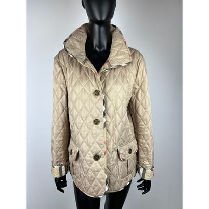 BURBERRY BRIT. Beige quilted jacket in polyester....
