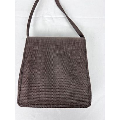 DIOR. Brown fabric clutch. Closing by a silver...
