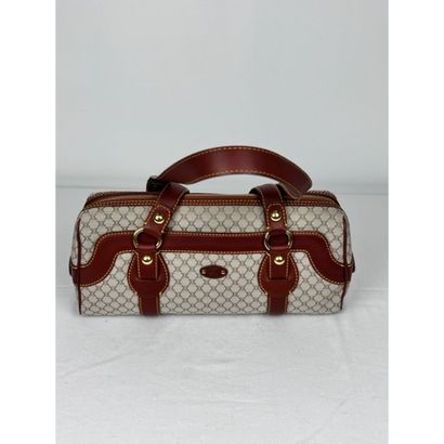 CELINE. Baguette in monogram canvas and gold...