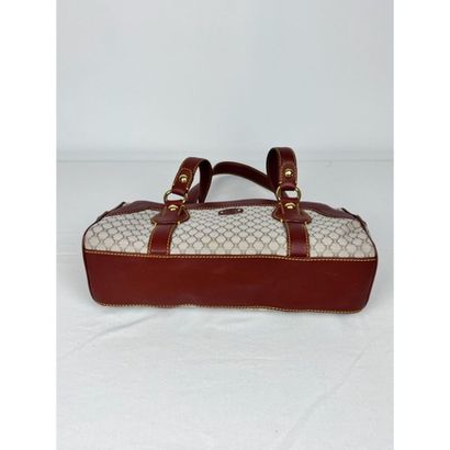 CELINE. Baguette in monogram canvas and gold...