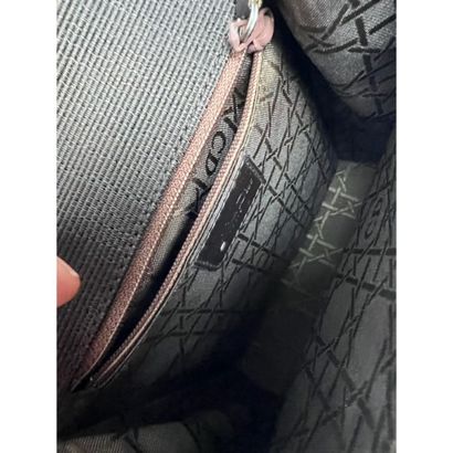 DIOR. Brown fabric clutch. Closing by a silver...
